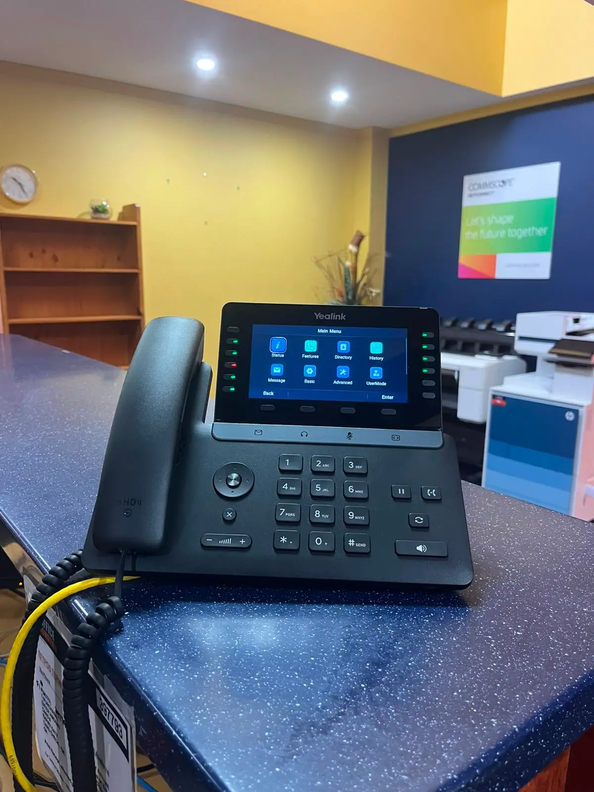 Yealink touchscreen handset on the front counter at our Mackay office.